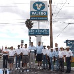Grandfathers for Golf President Tony Viola (center, holding check) poses with coaches and intermediate-level players at the Valero gas station in San Jacinto. The Valero Energy Foundation, on behalf of the Valero Texas Open golf tournament and pro golfer Brendan Steele, awarded the check to the youth program. 	Photo by Jim Crandall