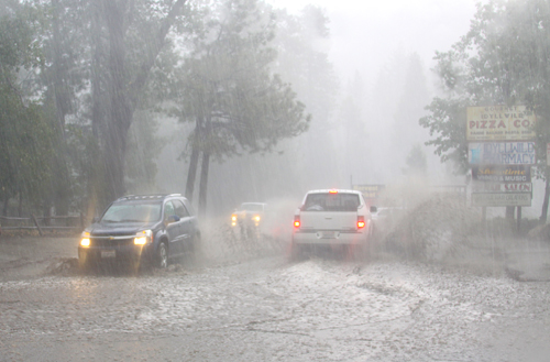 Village Center Drive becomes flooded with water and mud during the thunderstorm on an afternoon in August 2013. Photo by Jenny Kirchner