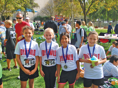 Idyllwild School fifth-grade girls (from left) Allyah Bride, Brooke Arnson, Leslie Pimental and McKenzie Nunez placed first in the fifth-grade team event at last week’s Middle School cross-country meet. Overall, Idyllwild students earned eight medals. Vinny Parillo placed in the seventh-grade boys run, Carmen Pratt in the eighth-grade girls, and Noah Rutherford and Evan Biley in the eighth-grade boys meet. Photo courtesy of Joe Neu