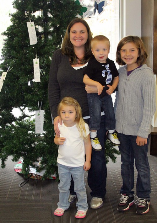 Idyllwild HELP Center Services Administrator Colleen Meyer and her kids, Peyton, 11, Brynnley, 4, and Caden, 2, set up Angel Christmas Trees at BBVA Compass Bank and in the back of the Idyllwild Library by the fireplace Monday morning. These trees have tags with presents or items that children are looking for that their families might not be able to afford this holiday season. Anyone in the community can take one of the tags and purchase the item at a store, returning the present with the tag to the Idyllwild HELP Center. This act of kindness may make that one child’s holiday season a bright one. Photo by Jenny Kirchner