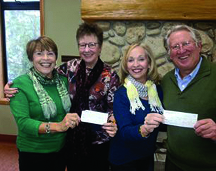 Karen Metz (left) and Anne Erikson (center right), of the Associates of Idyllwild Arts Foundation, deliver the proceeds from the Jazz in the Pines festival to Faith Raiguel (center left), chair of the Idyllwild Arts Foundation, and Buzz Holmes (right), a member of the Board of Governors. The money will help fund scholarships and the Bill Lowman Concert Hall capital campaign. Photo courtesy of Anne Erikson