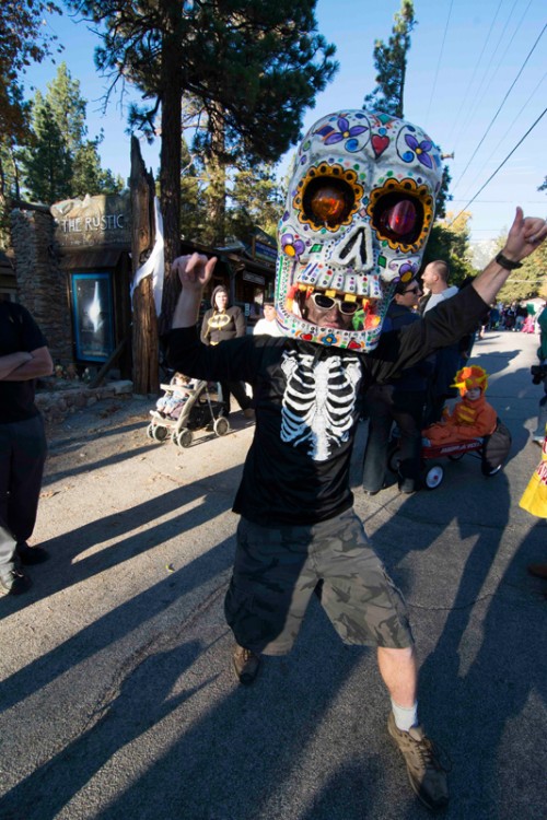 Colin Smith running around town with a skull he made at home out of a skate helmet, foam, and paper machet