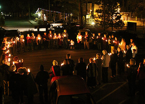 The Spiritual Living Center held its annual Candle Lighting ceremony Christmas Eve. With their candles, the congregation gathered in the parking lot at the end of the service while singing “Silent Night.” Photo by Jenny Kirchner