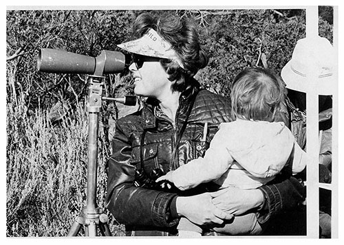 Betty Hazard placidly holds baby daughter Laura while sighting down a telescope at Lake Hemet during the 75th-annual Audubon Bird Count in December 1975. File photo