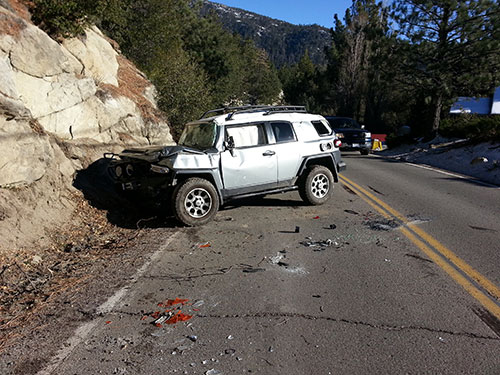 On Tuesday afternoon, Dec. 10, the Idyllwild Fire Department responded to a traffic collision on Highway 243 near the Strawberry Creek Bunkhouse. Upon arrival, firefighters found a Toyota FJ Cruiser blocking the northbound lane of Highway 243. Upon investigation, IFPD discovered that the vehicle had rolled off the private property directly above the highway after the owner exited the vehicle, possibly failing to engage the parking brake and/or take the vehicle out of gear. The vehicle landed on the highway, causing major damage to the vehicle, but the roadway was not damaged. IFPD personnel remained on-scene for less than an hour to direct traffic, while CHP investigated and the vehicle was removed from the scene. Photo courtesy Idyllwild Fire Chief Patrick Reitz