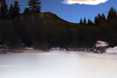 Stars shine over frozen Lake Fulmor New Year’s Day night. With temperatures in the 20s, the lake’s surface reflected the celebrating celestial crowd.              Photo by Jenny Kirchner