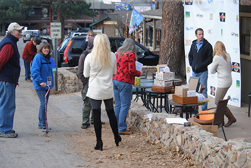 Idyllwild 2014 volunteers congregate outside the Rustic Theatre Tuesday morning, preparing to manage the week’s film festival. Movie venues include Silver Pines Inn and Astrocamp as well as the Rustic.