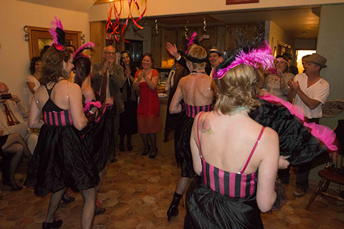 Christina Nordella’s “Midnight in Paris” party New Year’s Eve featured a visit from Cole Porter and a reading by Ernest Hemingway, but the Parisian Can-Can Girls brought the house down. Photo by John Pacheco
