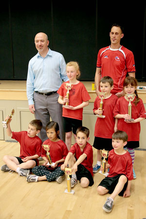 The kindergarten to third-grade division Red Ninjas team won its championship basketball game Friday night. The Red Ninjas (from left, back row) are Coach Bo Dagnall, Geneva Dagnall, Nathan Dunning, Kendra Collis and Coach Jason Sonnier.  In front (from left) are Carter Mclean, Meili Stroud, Tyler Sonnier and Silas Tiso. (Not pictured is Colby Sonnier.) Photo by Jenny Kirchner