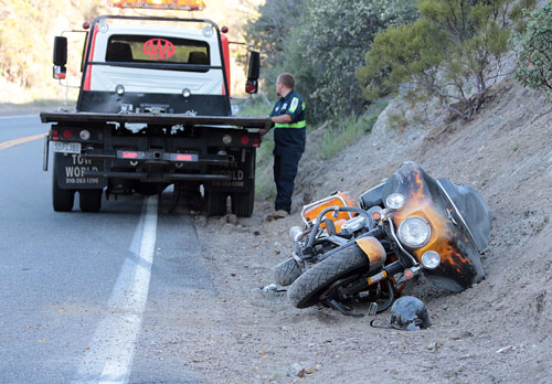 According to the rider of this Harley-Davidson motorcycle, he was traveling toward Anza on Highway 371 near mile marker 76.08  about 5 p.m. Monday, April 21, and took a corner a little too fast, went off the right shoulder into the dirt and flipped his bike landing on the right-hand side of the highway. The unidentified rider from Spring Valley was complaining of shoulder pain, but was not transported by emergency personnel. Photo by Jenny Kirchner 
