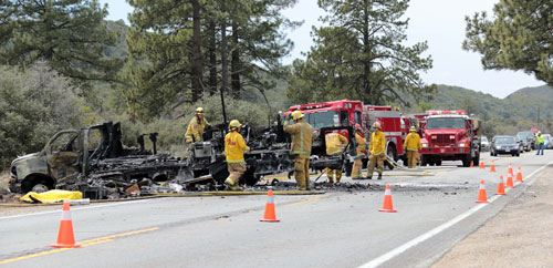 FATAL COLLISION: According to CHP Officer Darren Meyer, Nancy Pemberton, 65, of Rancho Mirage, was the driver of a 2014 Coachman RV involved with a fatal collision with a motorcycle on Sunday afternoon, April 27. The Riverside County Coroner’s Office has not released information about the El Segundo man killed riding the motorcycle. No one has been charged and the crash is still under investigation, but alcohol and drugs have been ruled out. The 2011 Honda motorcycle slammed into the driver’s side door of the RV, fatally injuring the man. Both the RV and motorcycle were fully engulfed in flames within minutes, also igniting vegetation on the side of the road. An unidentified male and Pemberton traveling in the RV along with two dogs, had minor injuries and were not transported by medical personnel. Highway 74 was closed for over an hour while CHP and fire personnel investigated the scene. Photo by Jenny Kirchner