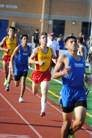 Tanner Torrez (far left) and Chad Schelly (center) finish the 800 meter race and helped Hemet High School’s track team defeat Beaumont High School Thursday, April 24. Photo by J P Crumrine
