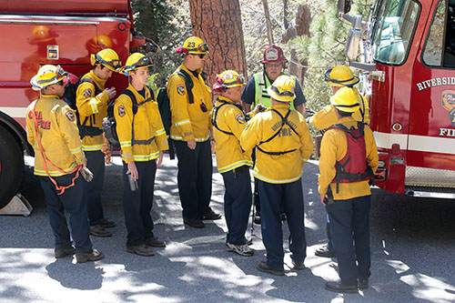 Fire personnel from Riverside County Fire prepare to rescue an injured rock climber who fell Monday afternoon, May 19. The team hiked in on Devil's Slide Trail from Humber Park. Photo by Jenny Kirchner