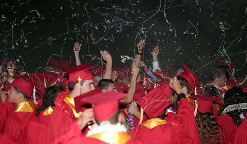 In lieu of throwing graduation caps, silly string was flying everywhere after the Hemet High graduates made it through the ceremony. Six hundred cans of silly string were used in the celebration following the awarding of diplomas to all graduates.             Photo by Jenny Kirchner 