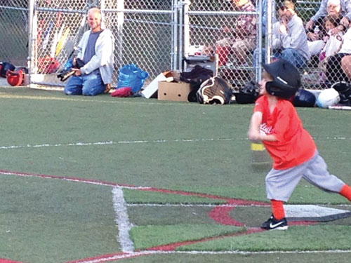 Zane Booth of the Giants tries hard to hit the ball against the Braves in Town Hall’s first kids coed baseball games of the season Monday night on the Idyllwild School field. Photo by Becky Clark 