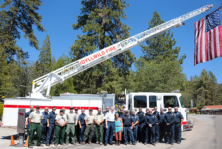 Idyllwild Fire, Cal Fire and the U.S. Forest Service pose in front of Truck 621 at the Idyllwild Fire Station Sunday afternoon during the one-year anniversary of the Mountain Fire. Photo by Jenny Kirchner