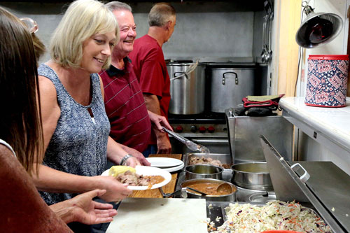 The Ladies Auxiliary put on the annual Fourth of July barbecue Saturday at the American Legion Post 800. Pork and beef, coleslaw, baked beans, corn and a bread roll were served on every plate. Photo by Jenny Kirchner