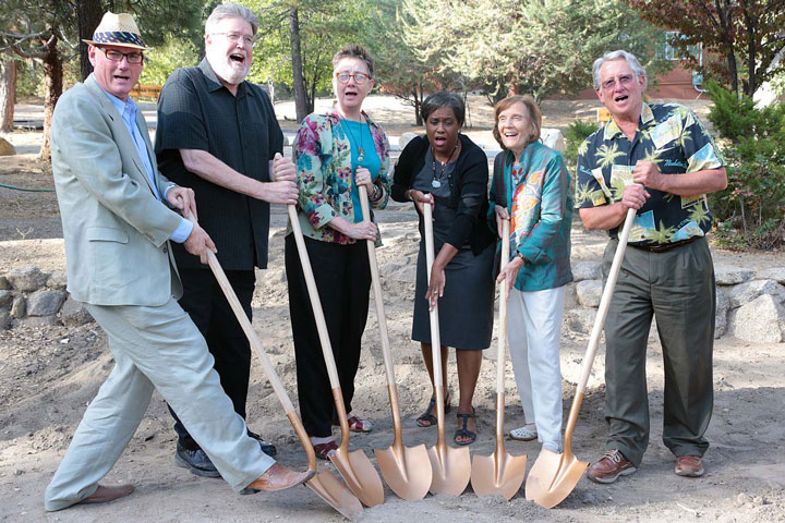 Bruce Ryan, Building and Grounds Committee chair; Bill Lowman, past Idyllwild Arts president; Faith Raiguel, immediate past board chair; Pamela Jordan, Idyllwild Arts president; Lillian Lovelace, Board of Governors and Buzz Holmes, campaign co-chair, pose for a photo and sing some songs Saturday during the Groundbreaking Celebration of the William M. Lowman Concert Hall.       Photo by Jenny Kirchner