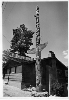 Bill Butler carved this totem pole on Highway 243 in 1948. In this photo, taken in 1972, the pole is located in front of Pine Cove Realty, no longer in existence. The pole, however, has lasted 66 years. File photo