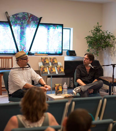Eduardo Santiago interviews Rob Roberge about his book, “The Cost of Living,” for the Idyllwild Author Series on Sunday at Cafe Aroma. The rain forced the interview to move inside at the Spiritual Living Center. Photo by John Pacheco