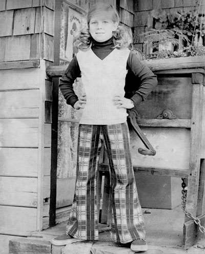 Cindy Walters is fashionably dressed for the third grade in plaid, brushed-denim slacks with a cotton turtleneck and a cotton vest in August 1974.        File photo