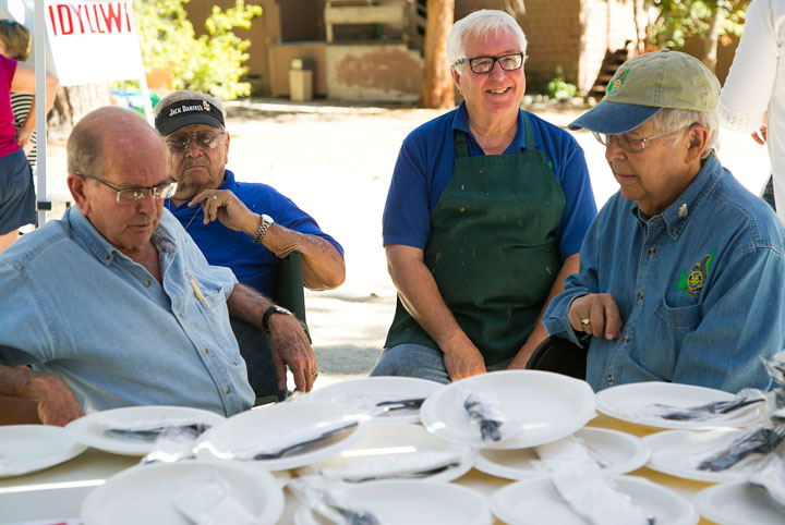Idyllwild Rotary members (from left) Charlie Wix, Ron St. Pierre, Scott Fisher and Mel Goldfarb plan their work assignments before the annual Rotary Club barbecue Sunday afternoon at Town Hall. Photo by Jenny Kirchner 