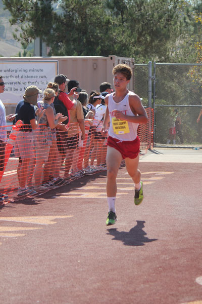 Chad Schelly is finishing in a time of 17:36. Photo by Jessica Priefer