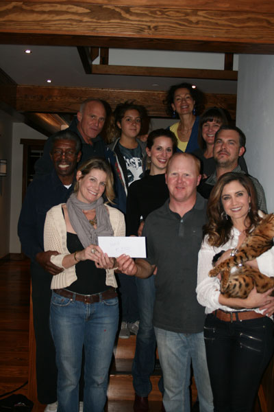 Brad (center) and Jacki Rechfertig (right), owners of the Grand Idyllwild Lodge, present Kirsten Ingbretsen (lower left) of the Art Alliance of Idyllwild with a check Monday night for more than $700 representing proceeds from a fundraising event hosted during the Art Walk and Wine Tasting on Oct. 11. Pictured from top left are Marshall Hawkins, Frank Ferro, Emily Jiminez, Jeni Sponseller, Mimi Jacaruso, Lori Ferro and Geoff Brown, who donated their time and talents to raise money for AAI. The money will be used for AAI’s scholarship fund.           Photo by Jay Pentrack 