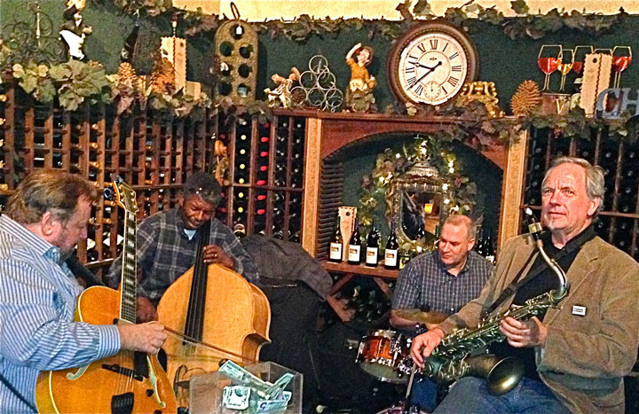 Jazzmotazz, comprising (from left) Doug MacDonald, guitar, Marshall Hawkins, bass, Dave Hitchings, drums, and Paul Carman, tenor sax, entertained with jazz standards and classics at Idyll Awhile Wine Shoppe Bistro in Village Center last Saturday evening. Photo by Jack Clark