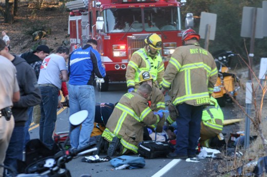 Paramedics work unsuccessfully on saving a Canadian motorcycle rider’s life Monday afternoon following a collision at 3:25 p.m. with a GMC pickup driven by a Palm Desert man, according to California Highway Patrol Officer Fernandez. The rider succumbed to his injuries at the scene. The crash is still under investigation and names were not released. The crash occurred on Highway 74, east of Highway 243. Photo by Jack Clark