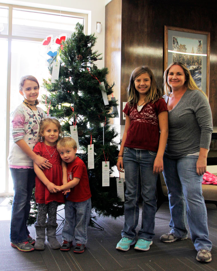 The Idyllwild HELP Center’s annual Angel Tree is up and decorated with the names of many children. Helping this year are (from left) Teagan White, Brynnley Meyer, Caden Meyer, Peyton Manchee and Colleen Meyer, at the HELP Center. This year, two Angel trees are available. Besides the tree at the Library (shown here), the second tree is at Fairway Market. “We have the most kids on the Angel Tree that we have ever had,” wrote Colleen, the HELP Center’s client services administrator. “We request that anyone that takes a tag would have the unwrapped gift to the HELP Center by Friday, Dec. 5.” Photo by John Drake