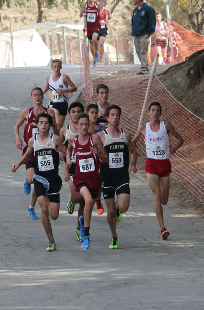 EMERSON COMES IN THIRD: As the runners near the finish line, Jayden Emerson (1223) of Idyllwild, was third of 116 runners in his heat. His time of 15:23 set the Hemet High School record at this course and was 15 seconds faster than his time for the 2013 CIF-SS prelims. This weekend, Jayden will run in the Southern Section Championship, also at Mt. San Antonio College.       Photo by Jessica Priefer 