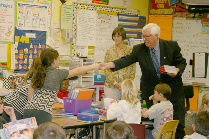 DICTIONARIES FOR ALL: Rotary members Scott Fisher (right) and John Graham handed out dictionaries to Mrs. Salter’s (Jeri John is pictured) third-grade class at Idyllwild School last week as part of the national Rotary program of providing all third graders in the country with a dictionary. Both Fisher and Graham are retired teachers. The Rotary is the largest and oldest civic organization in the world. Photo by Jay Pentrack