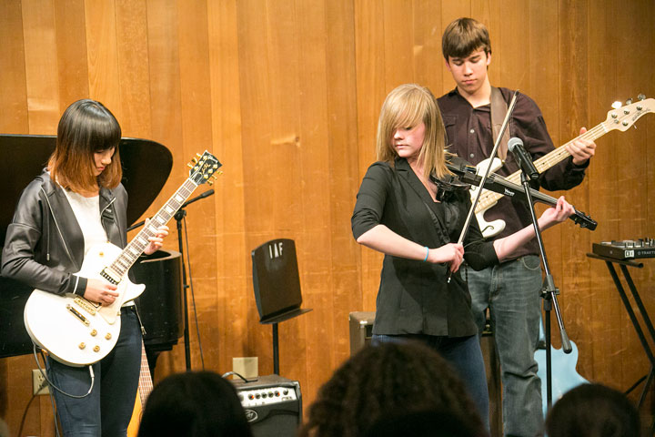 SONGWRITING: From left, Sumi Onoe, electric guitar, Madison Leinster, vocals and violin, and Owen Zorn, bass, perform “The Lion,” which Leinster wrote for the Idyllwild Arts songwriting class. Not pictured, but part of the group, are Miguel Soto, drums, and Cash Globe, piano. The Songwriting Concert was held at Stephens Recital Hall Tuesday, Nov. 11.  Photo by Jenny Kirchner