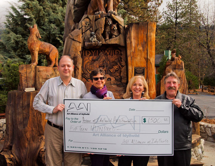 The season of giving continues as the Art Alliance of Idyllwild donates $1,500 to the Associates of Idyllwild Arts Foundation for the group’s efforts on behalf of Idyllwild Arts Academy and its promotion of the arts in Idyllwild. Shown (from left) are AAI President Marc Kassouf, Associates Vice President Pam Goldwasser, Associates President Anne Erikson and AAI past-President Gary Kuscher. Photo by Nathan Depetris 