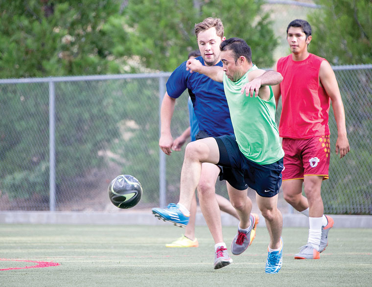 A new program, Town Hall Adult Soccer, started at Idyllwild School in 2014. Despite the threat of rain here, the games played on.          Photo by Jenny Kirchner