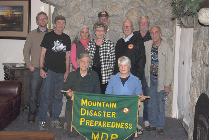 The Mountain Disaster Preparedness Board of Directors prepared its 2015 activities Monday, Jan. 19. Here in front (from left) are Francoise Frigola, Internet communications; and Pat Schnetzer, Red Cross; and (standing from left) Ian Schoenleber, vice president; B.J. Brix, communications; Gigi Kramer, medical coordinator; Sue Harper, secretary; Bob Edwards, treasurer; Mike Feyder, president; Thom Wallace, DAS director; and Chic Fojtik, public relations. Not present was Dr. Richard Goldberg, medical coordinator. Photo by J.P. Crumrine