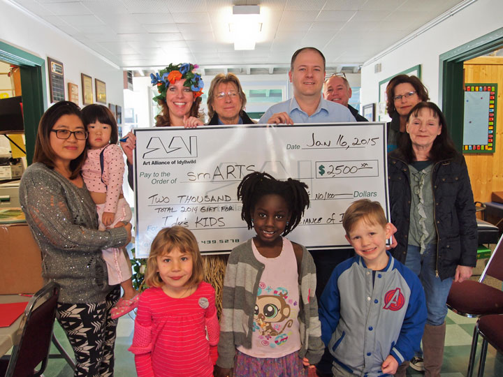HELPING SMARTS: The nonprofit Art Alliance of Idyllwild continues to partner with the local chapter of smARTS in order to keep art education alive for local youngsters. AAI recently donated $2,500 and fulfilled its pledge for 2014. Shown (from left) are Nayoun Hwang, prospective art instructor; smARTS General Coordinator Christina Nordella; Daryl Gillette, prospective art instructor; AAI President Marc Kassouf; and prospective art instructors Michael Newberry, Shanna Robb and Denise Ohrazda. In the foreground are kindergarteners and smARTS students (from left) Brynnley Meyer, Amelie Peebles and Jackson Brunett. Photo courtesy Lesly Martin 