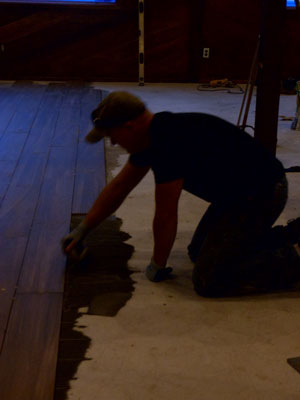 Contractor and co-owner of the Grand Idyllwild Lodge Brad Rechtfertig, lays wood-like tile in the dining area at Jo’An’s Restaurant last week.       Photo by Becky Clark