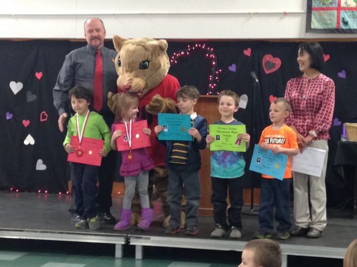 AWARDS: Students from Mrs. Draper’s kindergarten class were given awards Friday by substitute Mrs. Christiansen (far right). Principal Matt Kraemer and school mascot Rocky pose with award recipients Zeyn Hagi, Kaelynn Johnston, Darius Esparza, Nathan Lady and Ryley Smith. Each elementary school grade had their own ceremony that day to receive their mid-year awards. Photo by Teresa Garcia-Lande