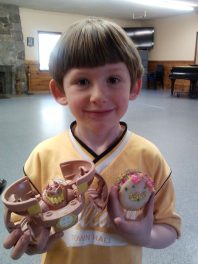 VALENTINE’S DAY CUPCAKES: Quintin Hoggan was very proud that his cupcake looked like his toy at Town Hall’s St. Valentine’s Day art class last Friday led by artist Mandy Johnson. Photo courtesy Wendy Watts 