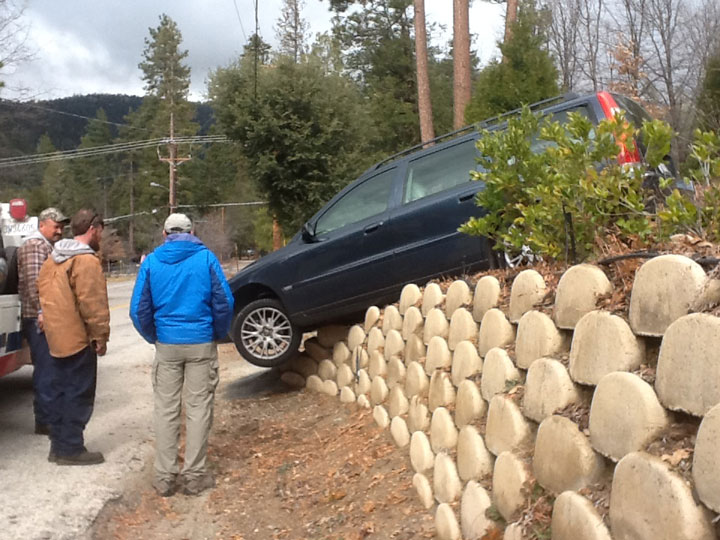 BAD TURN: A car that went off the edge of the driveway at Fern Valley Cottages across the street from Woodland Park Manor Saturday. The driver was attempting to use the circle driveway and missed the edge, according to witness Juls Phillips. She said neither the car nor the property suffered major damage and no one at the scene was injured. Photo by Juls Phillips