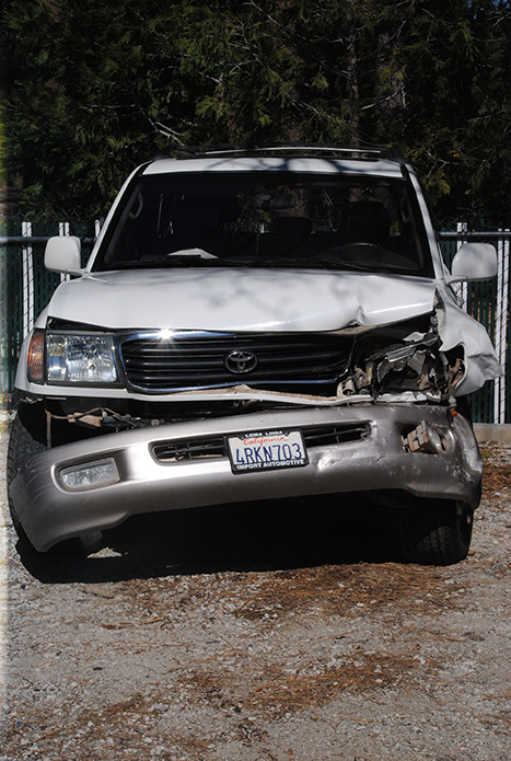 This SUV sustained front-end damage on Highway 74 Friday morning when it pulled out in front of an HUSD school bus, which struck it from hehind and drove it into a boulder. There were no injuries. Photo by Jay Pentrack