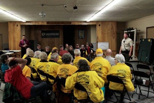 Riverside County Sheriff’s Deputy Chris Waters discusses the recent break-ins and offers suggestions to help prevent future crimes. The Mountain Community Patrol was a large portion of the Thursday’s audience. Hemet Station Capt. Ray Wood is on the left in background. Photo by John Drake