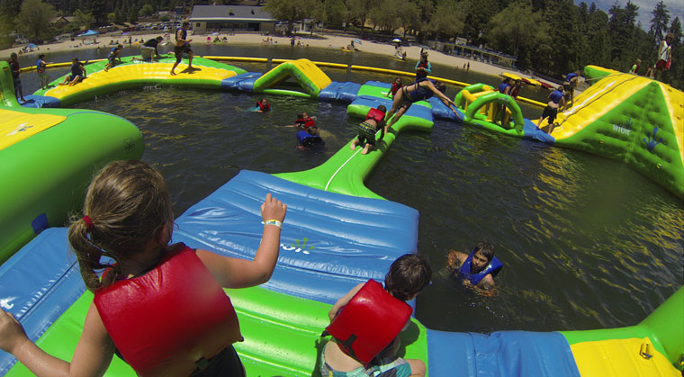 A photo of the inflatable water park, Splash Island, at Lake Gregory in the San Bernardino Mountains. The same park will be installed at Lake Hemet Campground and will open on Memorial Day 2015. Photo courtesy Kelly Lam, marketing director, the California Parks Company