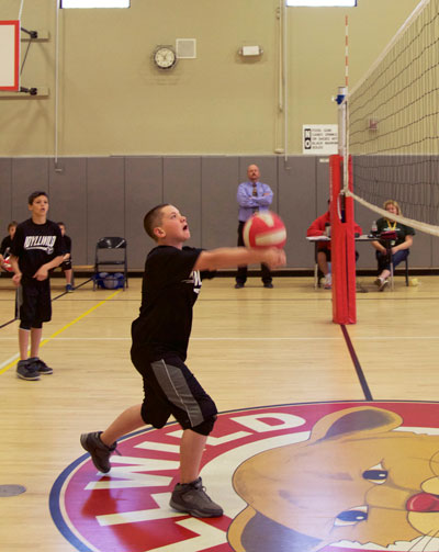 Aaron Potter sends it back over in the game against Nicolet Middle School on Monday. Nicolet won the match 2-1. Photos by John Drake