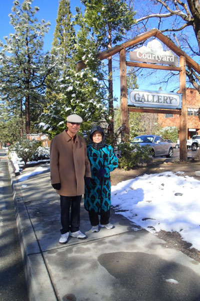 Chunki, 80, and Nyunghyun, 78, Chang, who were visiting from Riverside, were out enjoying the snow on their morning walk Tuesday. Photo by Halie Wilson