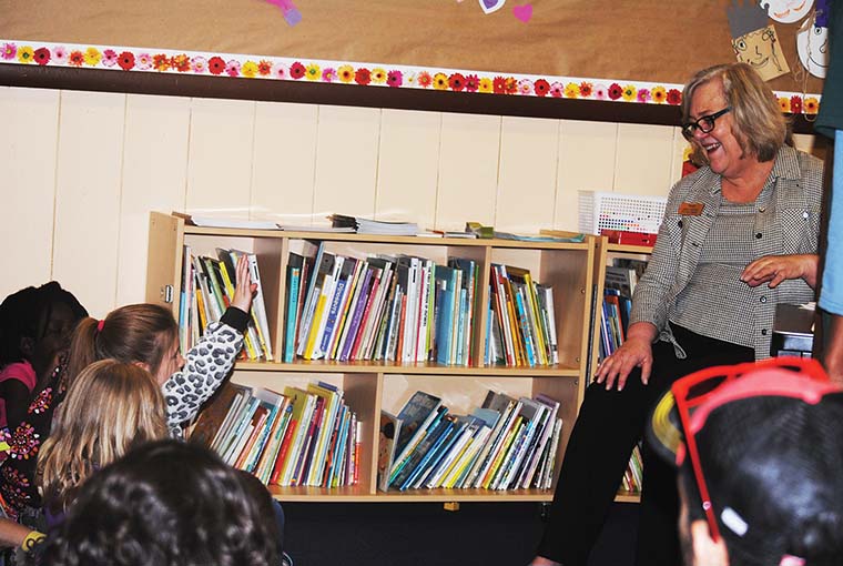 Susan Righetti, from the Idyllwild Library, describes the duties of a librarian Tuesday to the children at Town Hall, during “What do you want to be when you grow up?” Week (spring break from school). Photo by J.P. Crumrine