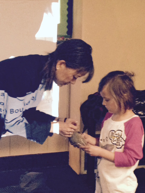 Dr. Jennifer Gee, of the James Reserve, shows a quail to Evelyn Johnson during spring break at Town Hall. Photo by Wendy Watts 