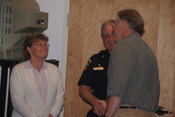 After Saturday’s community meeting on the Goldspotted oak borer, Kathleen Edwards, former Cal Fire staff, discusses the situation in Idyllwild with John Hawkins (center), Riverside County fire chief, and Dr. Tom Scott of the University of California, Riverside. Photo by J. P. Crumrine 